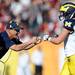 Michigan special teams coordinator Dan Ferrigno fist bumps wide receiver Drew Dileo after he ran for seven yards during a fake field goal play in the second quarter of the Outback Bowl at Raymond James Stadium in Tampa, Fla. on Tuesday, Jan. 1. Melanie Maxwell I AnnArbor.com